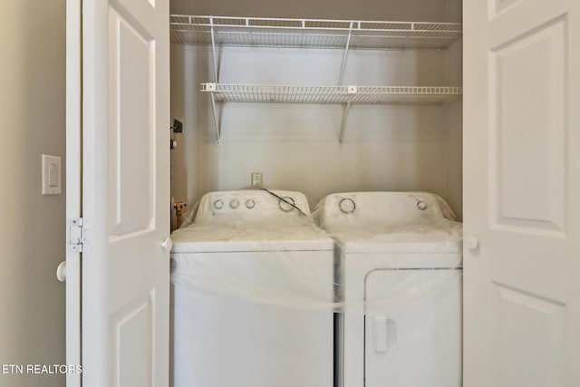 laundry room featuring laundry area and washing machine and dryer