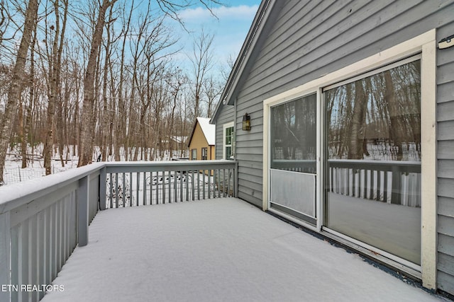 view of snow covered deck