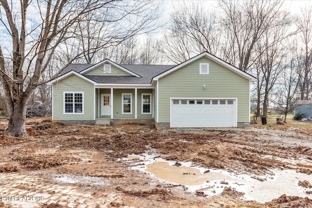 view of front of property with a garage