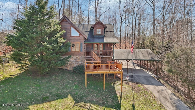 view of front of property with covered porch and a front yard