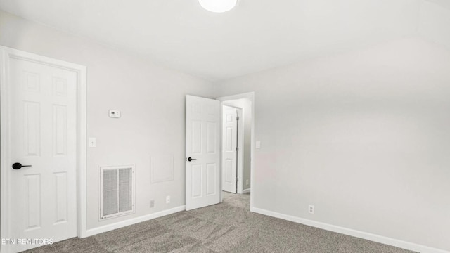 unfurnished bedroom featuring light colored carpet