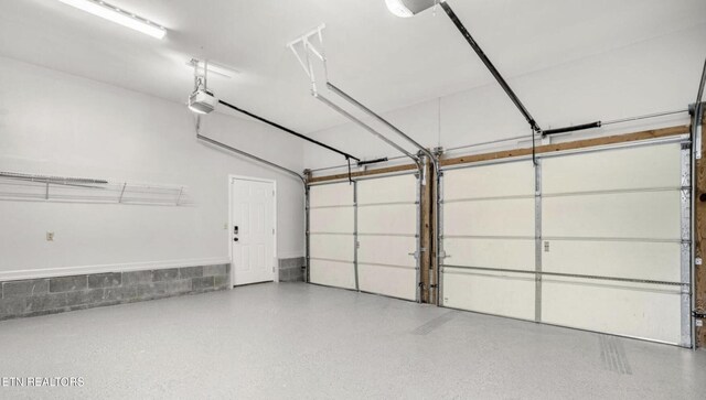 garage featuring a garage door opener