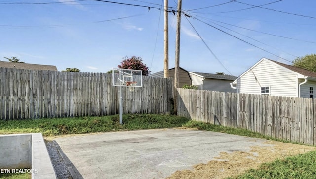 view of patio with basketball hoop