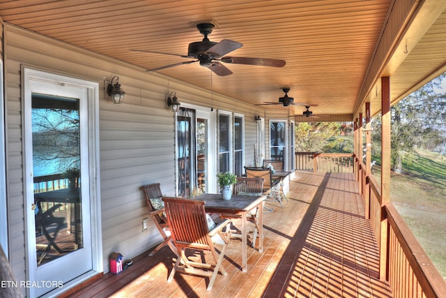 wooden terrace featuring ceiling fan