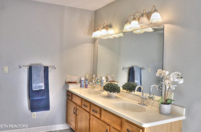 full bath with double vanity and a sink