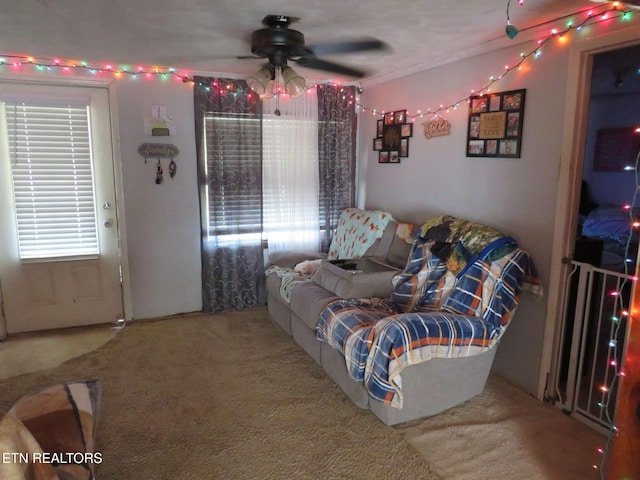 living room with carpet and ceiling fan