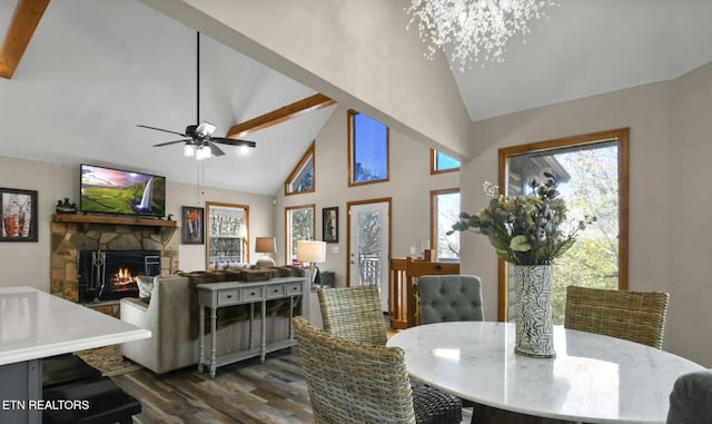 3809 Ravens Den Way, Sevierville, TN 37862 - dining room with dark wood-style floors, high vaulted ceiling, ceiling fan with notable chandelier, and a fireplace