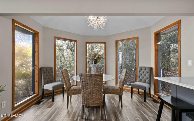 3809 Ravens Den Way, Sevierville, TN 37862 - dining space featuring a chandelier, visible vents, and wood finished floors