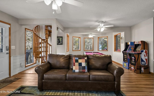 3809 Ravens Den Way, Sevierville, TN 37862 - living area with a textured ceiling, stairway, wood finished floors, and a ceiling fan