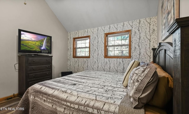 3809 Ravens Den Way, Sevierville, TN 37862 - bedroom featuring vaulted ceiling, baseboards, wood finished floors, and wallpapered walls