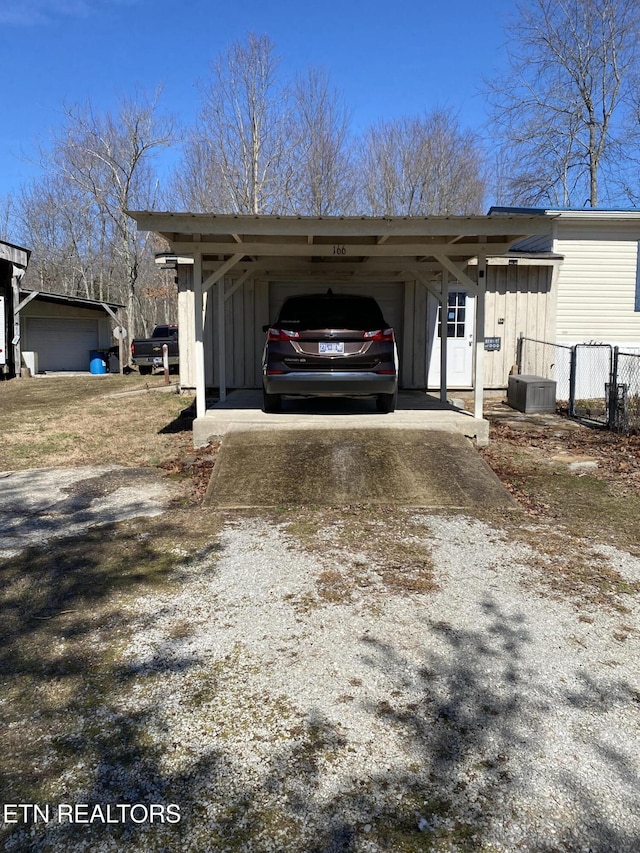 view of parking / parking lot featuring driveway