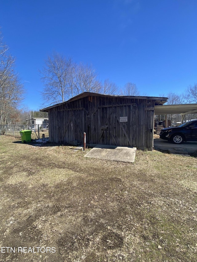 view of outdoor structure with a carport and an outdoor structure