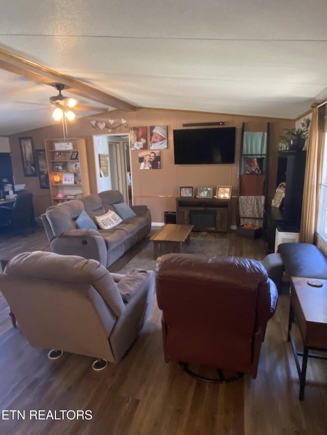 living area with lofted ceiling with beams, ceiling fan, and wood finished floors