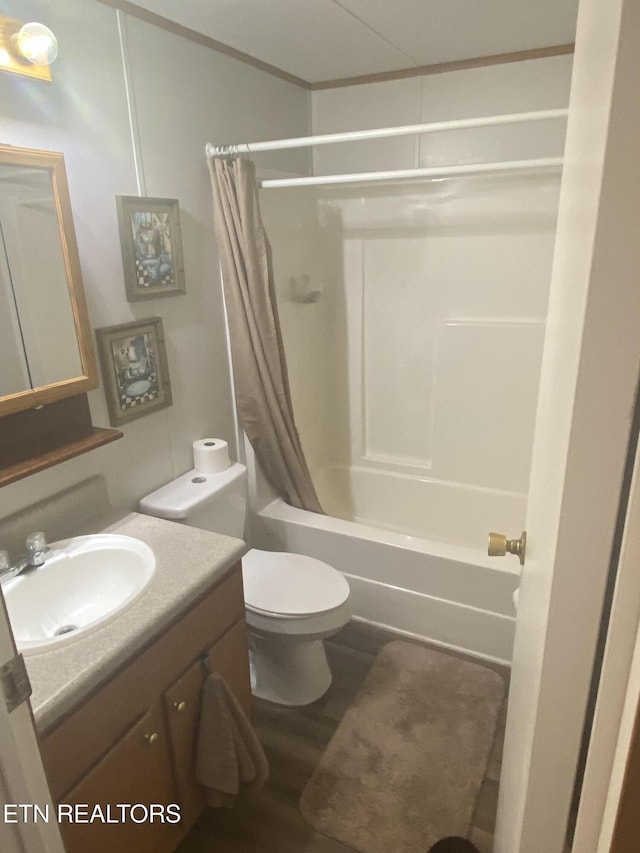 bathroom featuring wood finished floors, shower / bath combo, vanity, and toilet