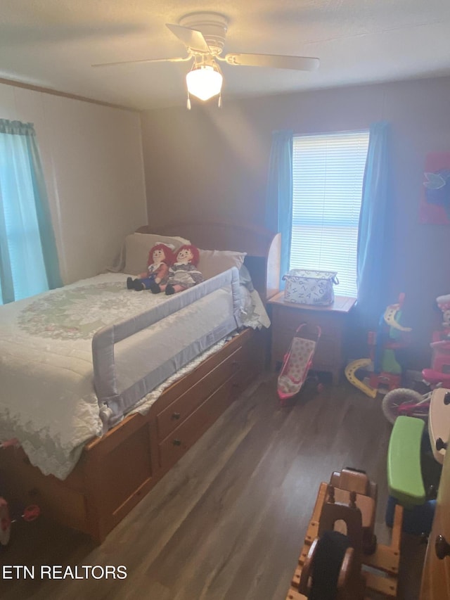 bedroom featuring ceiling fan and wood finished floors