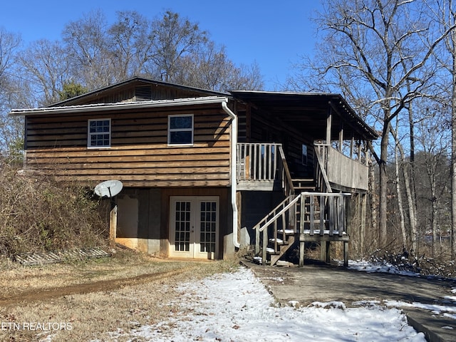 view of front of property featuring stairs and french doors