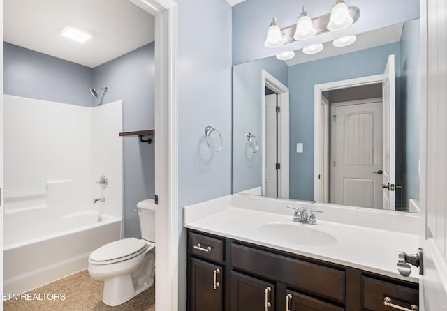 bathroom featuring shower / washtub combination, tile patterned flooring, vanity, and toilet