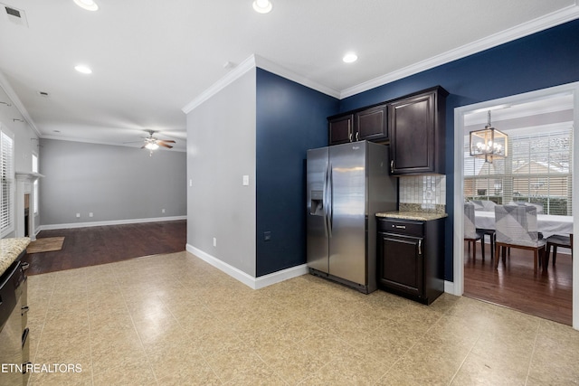 kitchen featuring open floor plan, stainless steel fridge, visible vents, and a healthy amount of sunlight