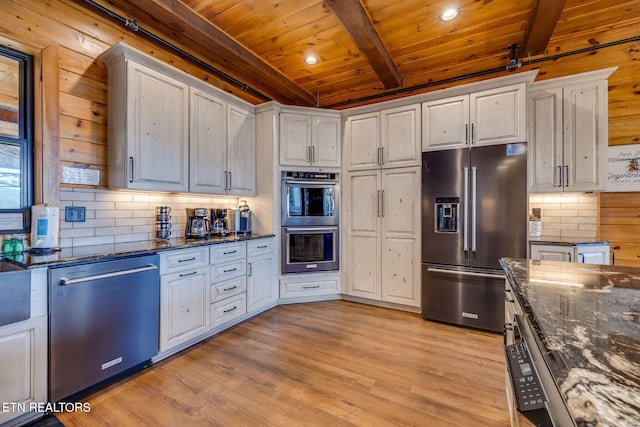 kitchen featuring tasteful backsplash, wooden ceiling, stainless steel appliances, light wood-style floors, and beam ceiling