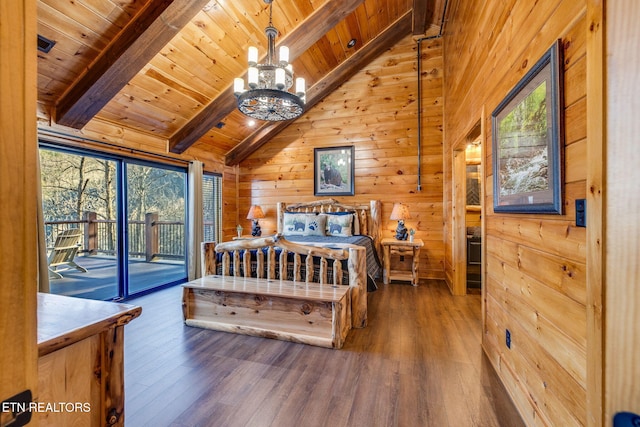 bedroom featuring vaulted ceiling with beams, wooden walls, wood finished floors, wood ceiling, and access to outside