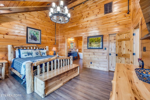 bedroom with wooden walls, visible vents, wooden ceiling, wood finished floors, and a notable chandelier