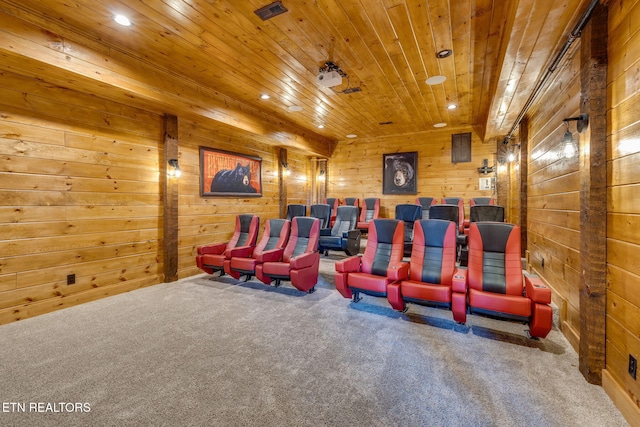 cinema room featuring wooden walls, visible vents, wood ceiling, carpet flooring, and recessed lighting