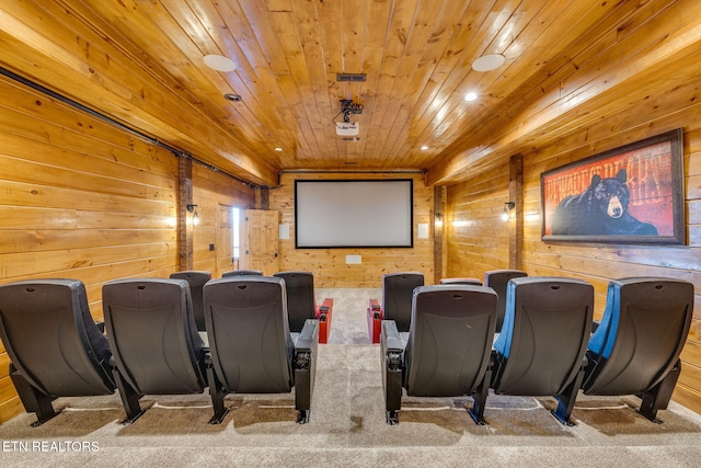 carpeted cinema room featuring wooden ceiling, wooden walls, and recessed lighting