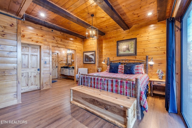 bedroom featuring wood walls, wooden ceiling, wood finished floors, and beam ceiling