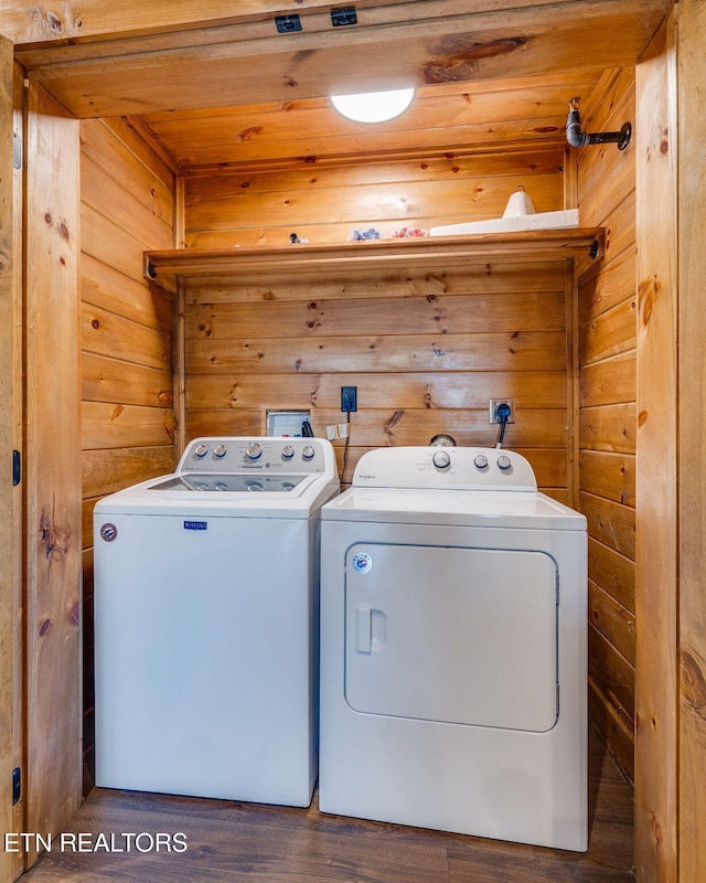 laundry area featuring laundry area, independent washer and dryer, wooden ceiling, and wooden walls