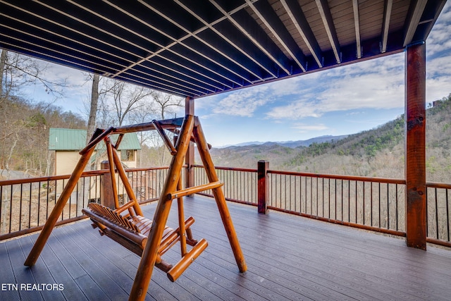 wooden deck featuring a mountain view