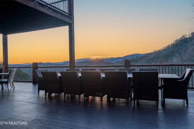 view of patio / terrace with outdoor dining area and a mountain view