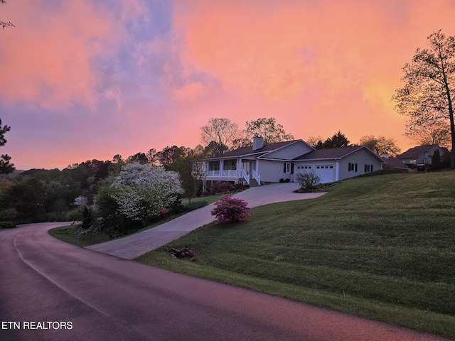 353 Southshore Dr, Greenback, TN 37742 - single story home with a front yard, concrete driveway, a garage, and a chimney