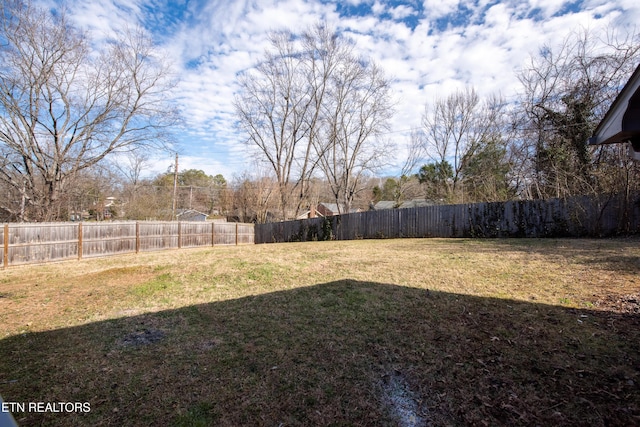 view of yard with a fenced backyard