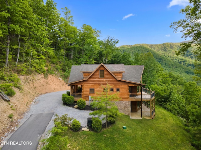 3859 Clabo Mountain Ln, Sevierville, TN 37862 - view of home's exterior with roof with shingles, a view of trees, driveway, and a deck