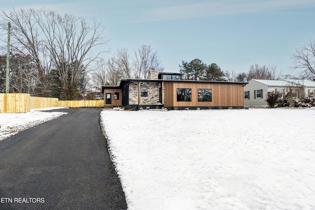 view of front of home featuring fence