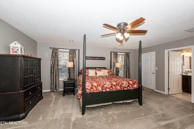 bedroom with light carpet, baseboards, visible vents, a ceiling fan, and a textured ceiling