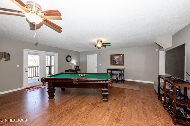 recreation room featuring billiards, a textured ceiling, and wood finished floors