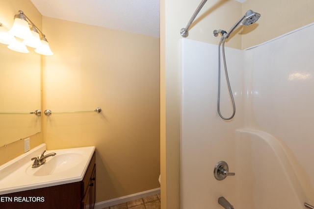 full bath featuring shower / washtub combination, vanity, and baseboards