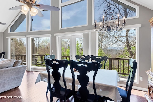 2201 Applewood Rd, Pigeon Forge, TN 37862 - dining space with ceiling fan with notable chandelier, wood finished floors, and a wealth of natural light