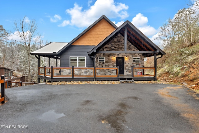 rustic home with stone siding