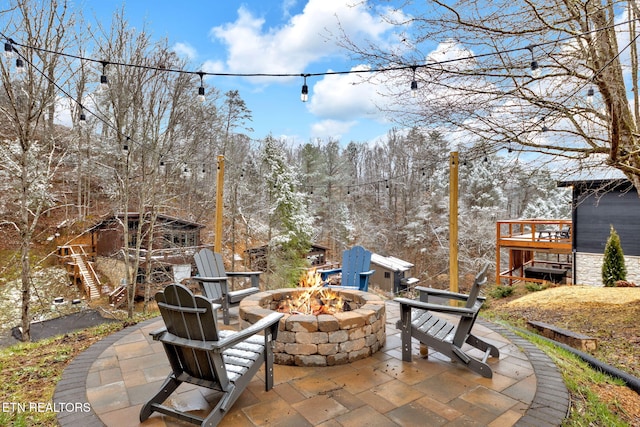 view of patio with an outdoor fire pit and stairway