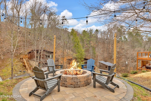 view of patio with an outdoor fire pit