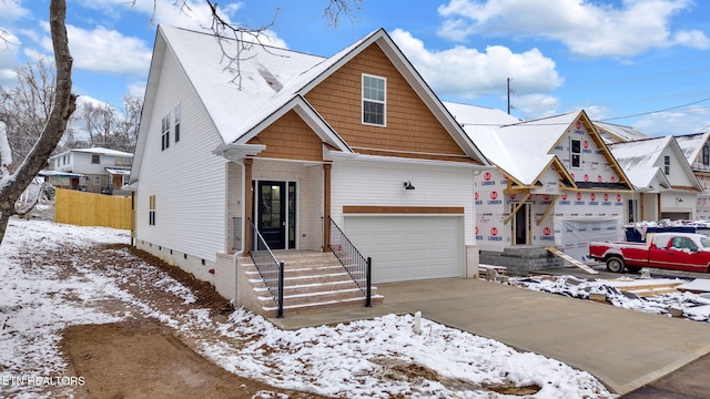 view of front of home featuring a garage, brick siding, driveway, crawl space, and a residential view