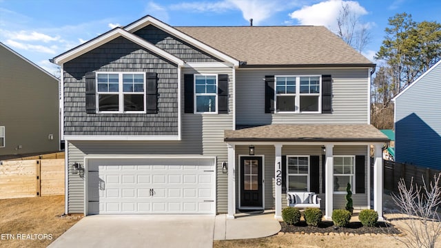 view of front facade with fence, an attached garage, covered porch, a shingled roof, and concrete driveway