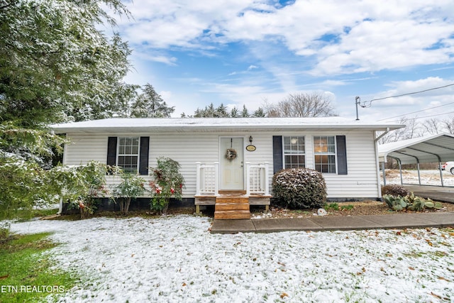 view of front of property with a carport