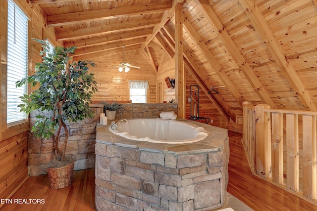 bathroom with vaulted ceiling with beams, wooden ceiling, wooden walls, and wood finished floors