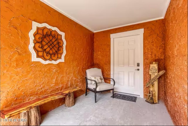 sitting room with unfinished concrete flooring