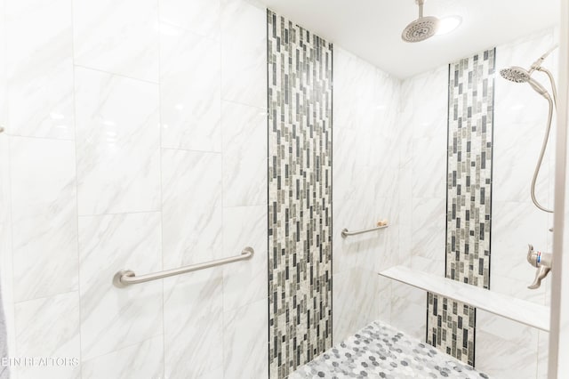 full bathroom with tiled shower