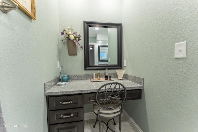 bathroom featuring vanity and baseboards