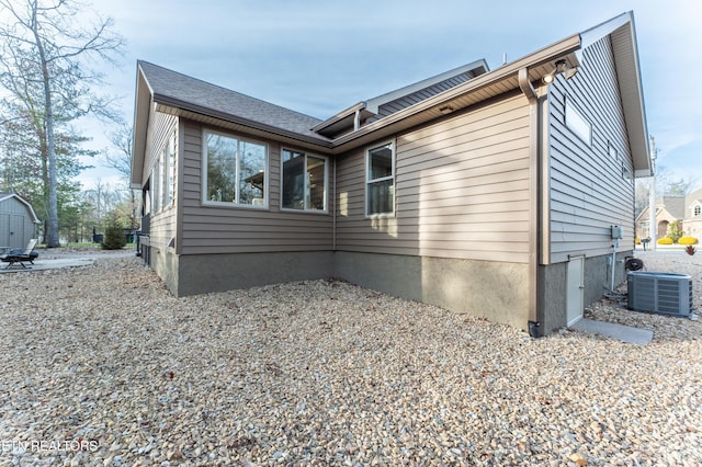 view of home's exterior featuring cooling unit